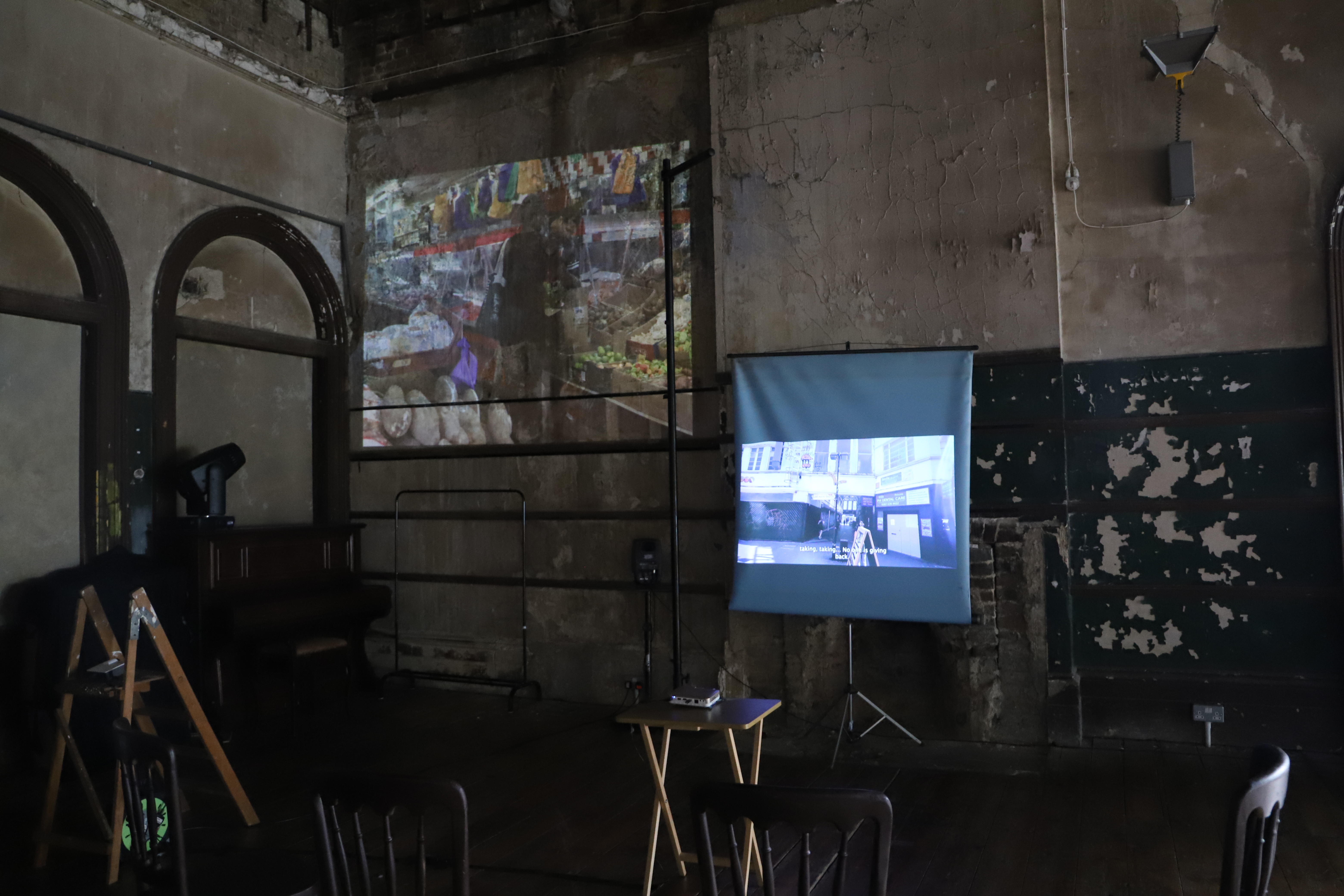 Photos and videos are projected onto the walls of the Old Waiting Room in Peckham Rye Station.