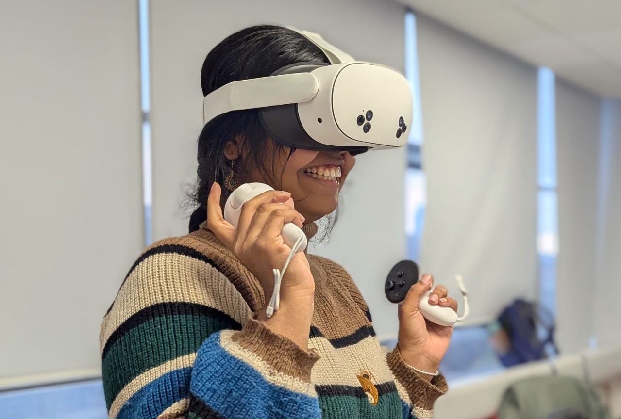 Saranya Satheesh happily testing the VR prototype.