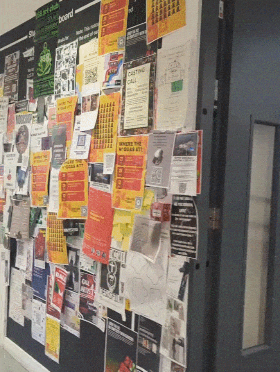 Animation of a series of walls with colourful posters, flyers and drawings.